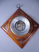 CARVED MAHOGANY WALL BAROMETER, 23cms square