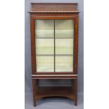 MAHOGANY CARVED RAILBACK DISPLAY CABINET, single door, carved edged detail with shaped lower