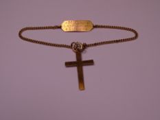 AMENDED DESCRIPTION - 9CT CRUCIFIX, 0.8grms, with a neat 9ct identification band on a yellow metal,