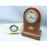 CLOCKS - a dome top mahogany mantle clock with inlaid shell to the centre, 35cms, and a mid-