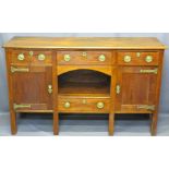 STAINED OAK SIDEBOARD with three drawers over central dog kennel, twin cupboards and lower