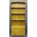 PINE BOOKSHELVES, four shelves over three base drawers on bun feet, 197cms H, 82cms W, 31cms D