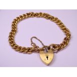 NOW BELIEVED NOT GOLD LINK BRACELET with padlock and safety chain, all links with 'crusty' pattern
