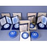 WEDGWOOD JASPERWARE CASED COMMEMORATIVE PLAQUES (5) plus two dressing table containers