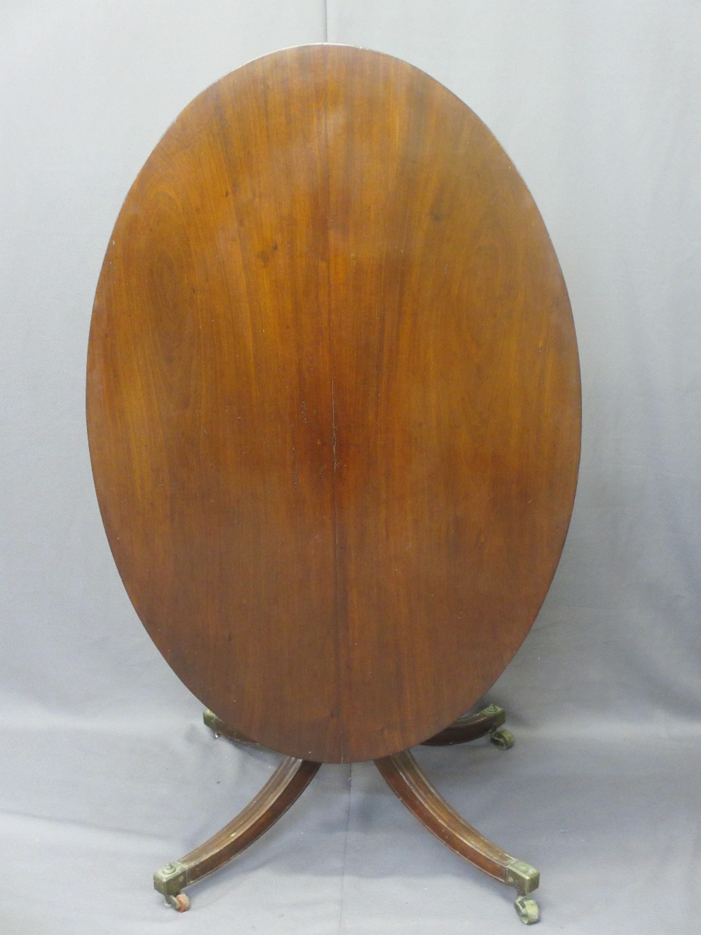 REGENCY MAHOGANY OVAL BREAKFAST TABLE turned column, splayed supports on castors, 70cms H, 123cms W, - Image 2 of 3