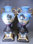 CAMEO STAFFORDSHIRE URNS on square bases, a pair, 66cms tall