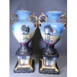 CAMEO STAFFORDSHIRE URNS on square bases, a pair, 66cms tall