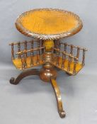 VICTORIAN WALNUT BOOK TABLE - garland carving to A 43cms diameter top, galleried revolving shelves