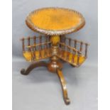 VICTORIAN WALNUT BOOK TABLE - garland carving to A 43cms diameter top, galleried revolving shelves