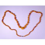 VINTAGE AMBER OVAL BEAD NECKLACE, 66.5grms gross, 104cms L of 67 individually knotted graduated