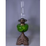 VICTORIAN OIL LAMP with iron base and green glass reservoir