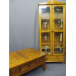 PINE COFFEE TABLE with central drawer, 46cms H, 107cms W, 77cms D and a two door glazed cupboard