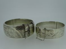 VINTAGE SILVER BANGLES (2), one London 1959 of hinged ornate form and one Birmingham 1960 of