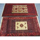 EASTERN STYLE WOOLLEN CARPETS (2) both red ground, similarly bordered, both with central bird