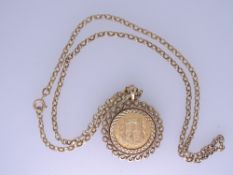 ELIZABETH II GOLD HALF SOVEREIGN 2002 in a 9ct gold circular pendant mount and belcher chain