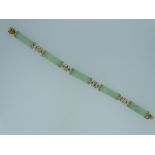 9CT GOLD & GREEN JADE BRACELET made up of five long shaped panels of pale green Chinese Jade