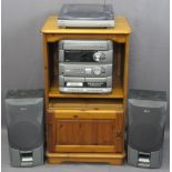 AIWA STEREO SOUND SYSTEM WITH SPEAKERS in a modern pine entertainment cabinet, 99cms H, 57cms W,