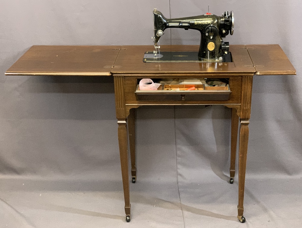 VINTAGE SINGER ELECTRIC SEWING MACHINE in a mahogany worktable, 83cms H, 64cms W, 45cms D