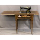 VINTAGE SINGER ELECTRIC SEWING MACHINE in a mahogany worktable, 83cms H, 64cms W, 45cms D