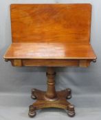 VICTORIAN MAHOGANY FOLDOVER TEA TABLE on a turned column and quatrefoil base with bun feet, 73.