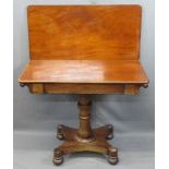 VICTORIAN MAHOGANY FOLDOVER TEA TABLE on a turned column and quatrefoil base with bun feet, 73.