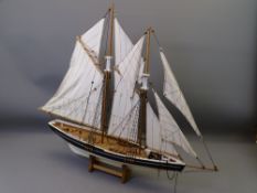 MULTI-SAIL POND YACHT on wooden stand, 66cms H x 75cms L