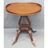 REPRODUCTION MAHOGANY TRAY TOP SIDE TABLE on a carved lyre support and carved knee four footed base,
