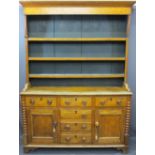 NORTH WALES OAK DRESSER with three shelf rack over three drawers, two base cupboards with three