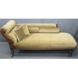 ANTIQUE CHAISE LONGUE upholstered in brown with stud detail, scroll and floral carvings on turned