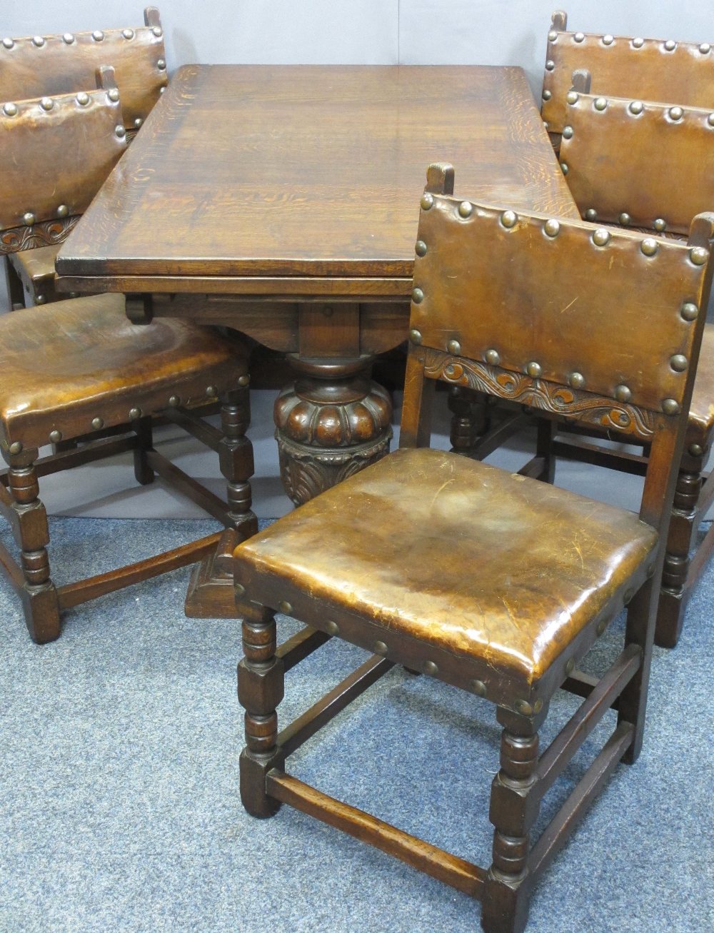 EXCELLENT QUALITY OAK DRAW LEAF DINING TABLE and five leather seated dining chairs, the table with