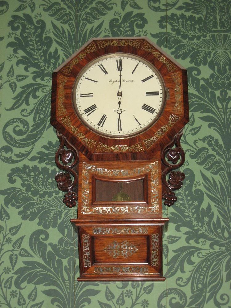 A FINE ROSEWOOD & MOTHER OF PEARL INLAID PENDULUM WALL CLOCK, the circular dial set in an