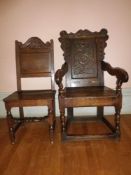 WAINSCOT TYPE CARVED OAK ARMCHAIR CIRCA 1760 and a later single oak side chair with carved crest