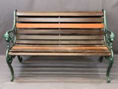 WOODEN SLATTED GARDEN BENCH with decorative cast iron ends, 77cms H, 126cms W, 40cms seat depth