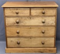 VICTORIAN MAHOGANY CHEST of two short over three long drawers with turned wooden knobs on a plinth