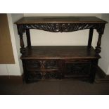 LATE 19TH CENTURY CARVED OAK BUFFET SIDEBOARD, the upper shelf having a carved and scrolled apron
