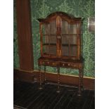 WALNUT DISPLAY CABINET, one piece of neat proportions, the top having a domed hood with twin