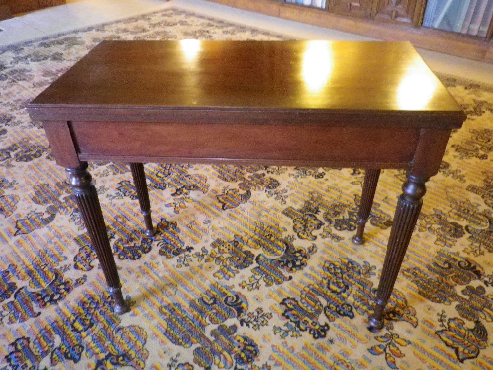 REGENCY MAHOGANY FOLDOVER CARD TABLE, the rectangular top opening in twist format to reveal a