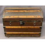 DOME TOP TRUNK, wooden banded, on castors, metal cuppings and handles, 58cms H, 78cms W, 47cms D