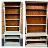 TWO GOTHIC STYLE VICTORIAN PAINTED PINE BOOKCASES having shaped canopy tops with carved