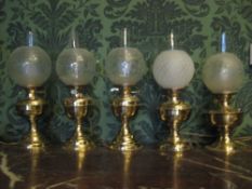 THIS LOT IS PART OF THE CONSIGNMENT FROM BODELWYDDAN CASTLE FIVE CIRCULAR BASED BRASS OIL LAMPS,