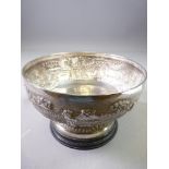 INDIAN STERLING SILVER PEDESTAL BOWL on ebonized circular stand, 10cms H overall, 17cms diameter