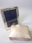 PRESENTATION SILVER CIGARETTE BOX and a modern Carrs sterling silver photograph frame, Birmingham