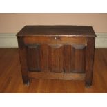 AN 18TH CENTURY SMALL OAK COFFER, the triple plank top over three fielded front panels, 105cms W