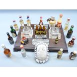 ANTIQUE DESK STAND with glass inkwells and pen holder inserts and a quantity of alcohol