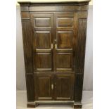ANTIQUE OAK ONE PIECE STANDING CORNER CUPBOARD, twin upper and lower doors with chamfered panels,