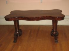 19TH CENTURY ROSEWOOD SIDE TABLE, the top of shaped and curved form with end turned pedestals with