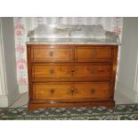 AN EDWARDIAN PINE WASHSTAND with white marble back and side rail top with small oval half-moon shelf