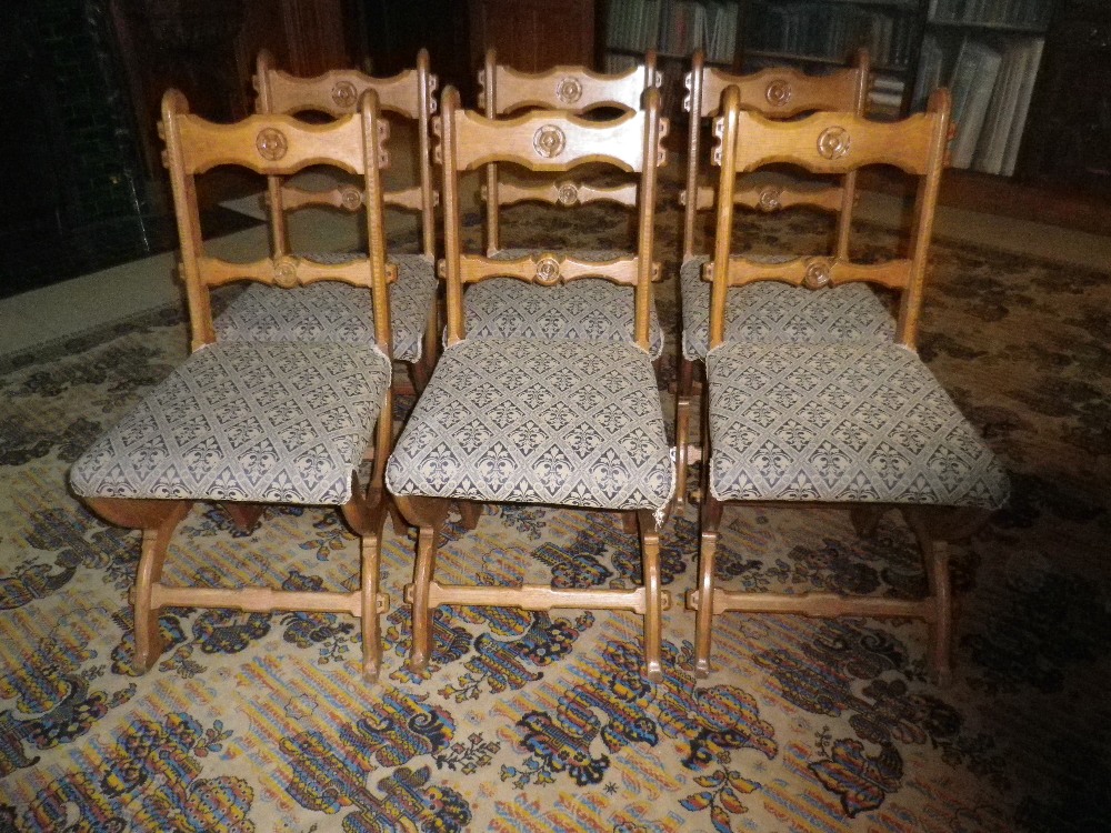 SET OF 6 GOTHIC STYLE SALON/DINING CHAIRS having rose roundels carved to the crest and central