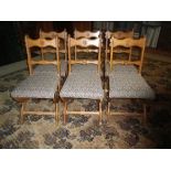 SET OF 6 GOTHIC STYLE SALON/DINING CHAIRS having rose roundels carved to the crest and central