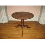 19TH CENTURY CIRCULAR OAK TRIPOD TABLE having centre turned pedestal on pad supports, 85cms